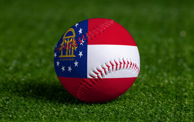 Baseball with Georgia flag on green grass background, close up