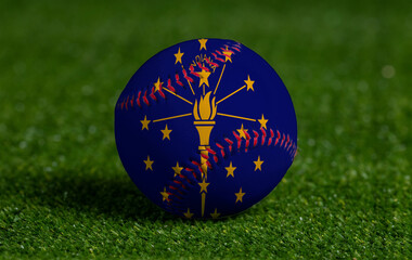 Baseball with Indiana flag on green grass background, close up