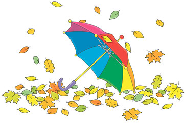 Toy kids umbrella among colorful fallen autumn leaves in a park, vector cartoon illustration isolated on a white background