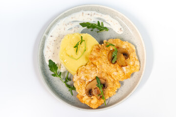 Chicken fritters with mashed potatoes on a white background top view