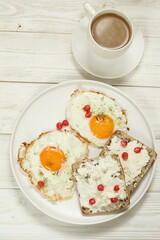 Scrambled eggs with coffee on white background