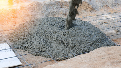 Pouring cement during sidewalk in construction site