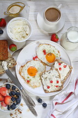 Scrambled eggs with coffee on white background