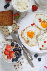 Fried eggs with soft, cream cheese and coffee sandwiches