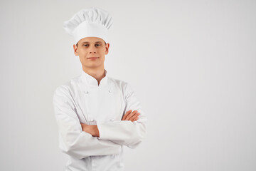 man in chef uniform self-confidence professional restaurant light background