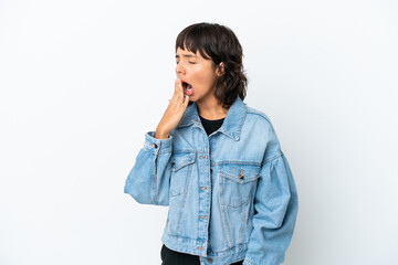 Young mixed race woman isolated on white background yawning and covering wide open mouth with hand