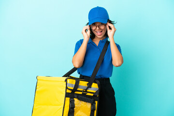 Young delivery woman with thermal backpack with glasses and surprised