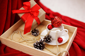 Christmas background - wooden tray with gift box and christmas decorations