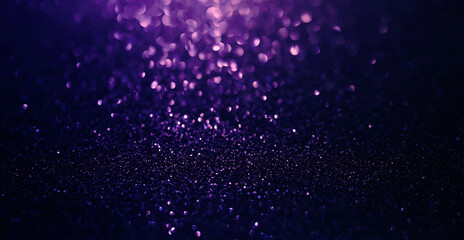 Abstract background of purple  glitter lights. De-focused background.	