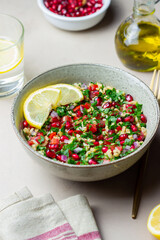 Tabbouleh salad with bulgur, mint, parsley, tomatoes and pomegranate. Healthy eating. Vegetarian food.