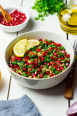 Tabbouleh salad with bulgur, mint, parsley, tomatoes and pomegranate. Healthy eating. Vegetarian food.