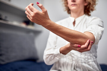 Woman with arm, elbow, wrist and ligament issues.