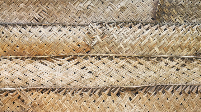 Dried palm leaf braid wall, natural background.