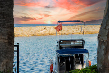The streets of the city centre, the bazaar and the port area in Side, Antalya. a boat moored to the shore. breakwater and sunset. Selective Focus Boat