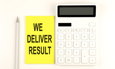 text WE DELIVER RESULT on yellow sticker, next to pen and calculator