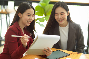 Businesswomen in the office brainstorming and discussing a new marketing strategy