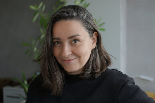 Portrait of a 39 years old woman with gray hair