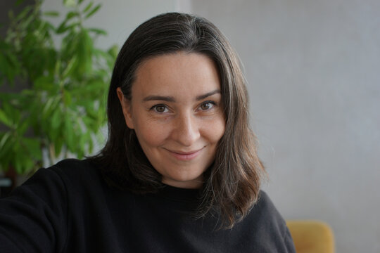 Portrait of a 39 years old woman with gray hair
