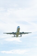 Aircraft taking off with landing gear on with nice sky.