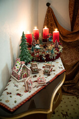 Christmas table composition. Beautiful decoration. Christmas trees, candles, stars, lights and elegant accessories. Merry Christmas and Happy Holidays, Template.