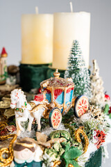 Obraz na płótnie Canvas Christmas table composition. Beautiful decoration. Christmas trees, candles, stars, lights and elegant accessories. Merry Christmas and Happy Holidays, Template.