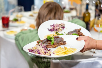 Waiter Carrying Food Plates