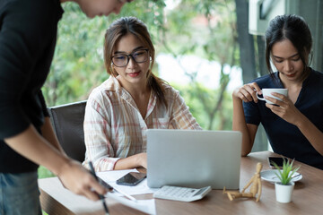 Business Asian people team discussing working analyzing with financial data and marketing growth report graph in team, presentation and brainstorming to strategy planning making profit of company.