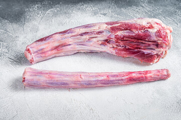 Raw whole Beef veal Oxtail Meat on butcher table. White background. Top view