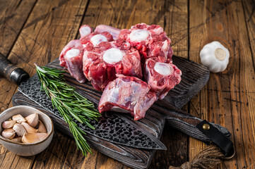 Raw beef Oxtail cut Meat on wooden cutting board with knife. wooden background. Top view