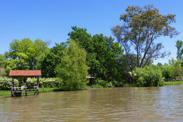 Fototapeta na wymiar Canal with pier, Parana delta, Tigre, Buenos Aires, Argentina