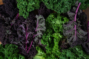 red and green kale on brown wooden surface
