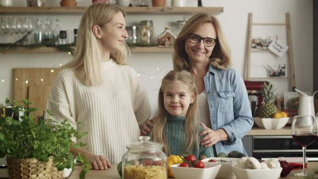 Video portrait of three generations of women in kitchen. Shot with RED helium camera in 8K.