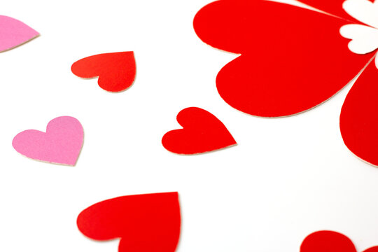 heart shaped red and pink paper isolated on a white background, concept love and valentine's day.