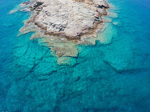 Azure water texture, transparent sea surface with a rocky bottom. Aerial view, Naxos,natural blue background © Eric Isselée