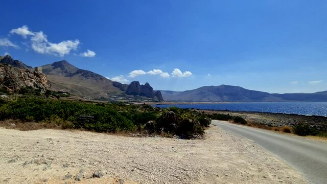 Panning view of Baia Santa Margherita and surrounding landscape in western Sicily coast close to San Vito Lo Capo
