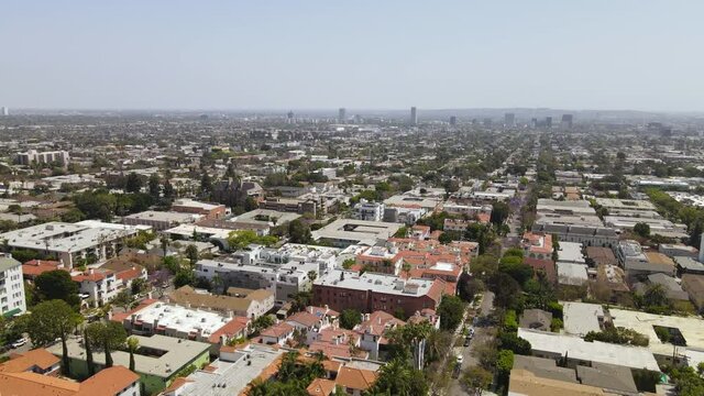 Downtown Los Angeles From West Hollywood. Aerial View of Cityscape and Buildings on Misty Sunny Day, Drone Shot