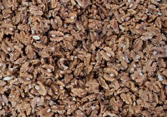 Real food background: peeled walnuts. Close-up, veiw from above