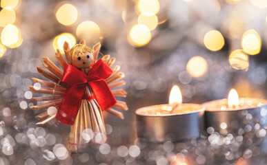 Angel, lights, candle at christmas time