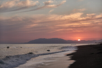Sunset on the beach of Benajarafe. Malaga. Andalusia. Spain.