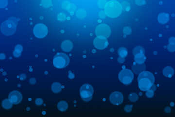 Round defocused bokeh on dark blue background
