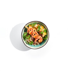 Chinese traditional dish - fried rice with egg, vegetables, and prawn. Pan asian wok with rice and shrimp on white background. Nasi goreng with prawns on isolated background with shadows.
