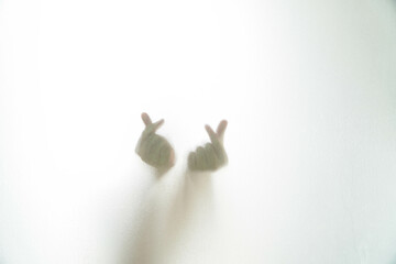 Korean symbol of love with your fingers fingers glass is wet.