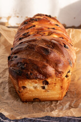 Brioche with chocolate chips on wooden background,french recipe