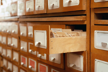 Fototapeta na wymiar Closeup view of library card catalog drawers