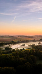 Fototapeta premium Smartphone Wallpaper, Fog in the Meadows and Forest at Sunrise, France