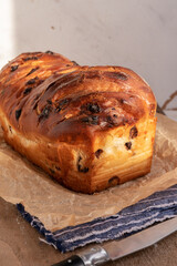 Brioche with chocolate chips on wooden background,french recipe