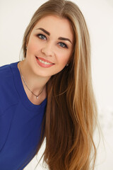 Obraz premium Young beautiful woman with long hair in a dress
