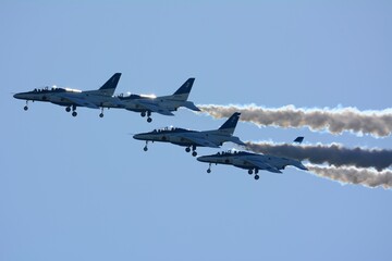 JASDF aerobatic team Blue Impulse flying in deep blue sky
