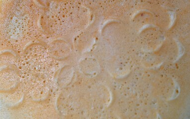 Abstract close-up beige candy plate background texture