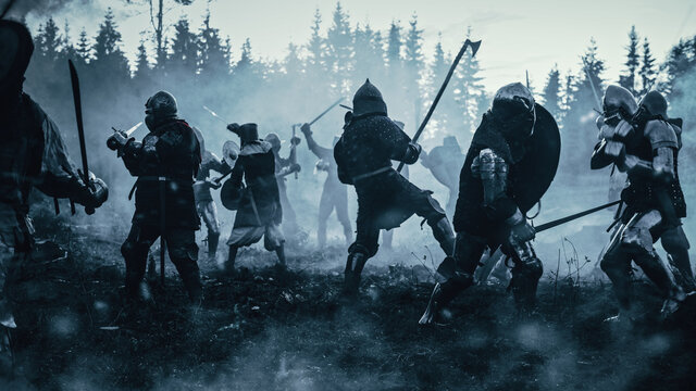 Epic Battlefield: Armies of Medieval Knights Fighting with Swords. Dark Ages Warfare. Action Battle of Armored Warrior Soldiers, Killing Enemies. Blue Cinematic Historical Reenactment.